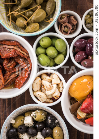 Selection of tapas in ceramic bowls Selection of tapas in ceramic bowls 38586380