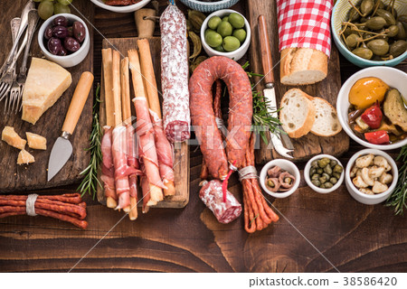 Authentic spanish tapa on wooden bar table. Authentic spanish tapa on wooden bar table. 38586420