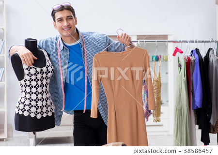 Male tailor with female student in workshop 38586457