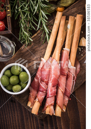 Bread sticks with prosciutto ham,spanish tapa bar  38586583