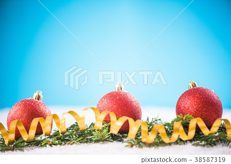 Christmas ornaments on snow background Christmas ornaments on snow background 38587319