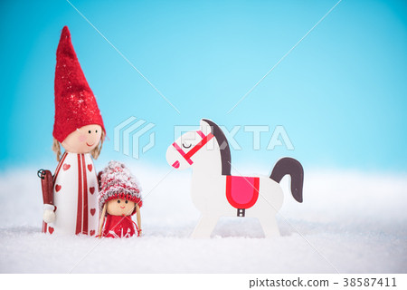 Happy family and rocking horse on snow 38587411
