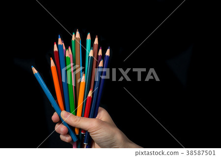 Four balls of colored wool skewered  38587501