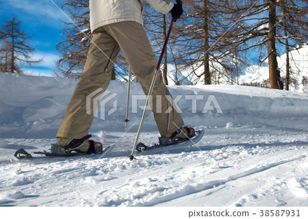 Walk with snowshoes Walk with snowshoes 38587931