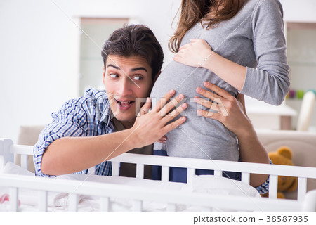 Young parents expecting their first baby 38587935