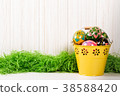 Easter eggs in bucket on white wooden background 38588420