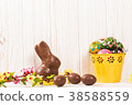 Easter chocolate bunny and eggs on white wooden 38588559
