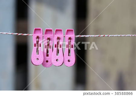 clothespins on a rope outdoors. macro clothespins on a rope outdoors. macro 38588866