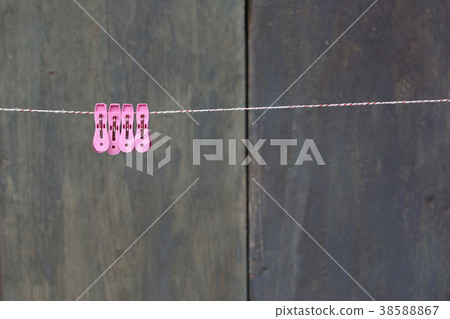 clothespins on a rope outdoors. macro clothespins on a rope outdoors. macro 38588867