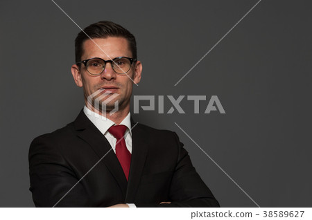 Cute businessman posing in studio 38589627