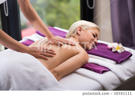 Enjoying Massage Treatment 38591111