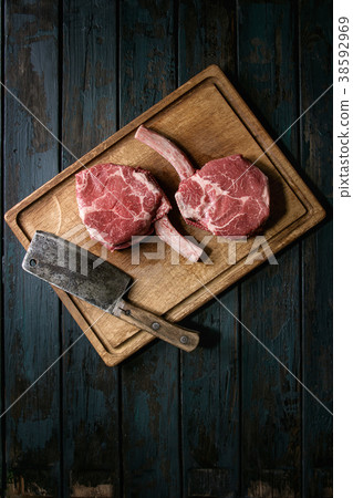 Raw tomahawk steak 38592969