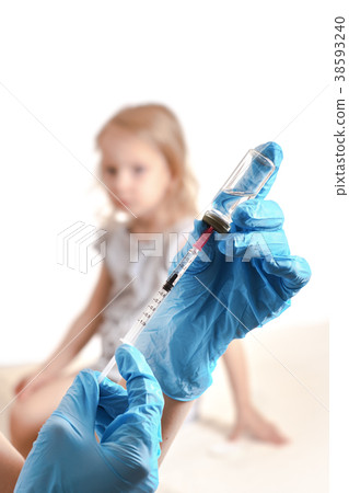 Vaccination concept. Doctor holding a syringe Vaccination concept. Doctor holding a syringe 38593240