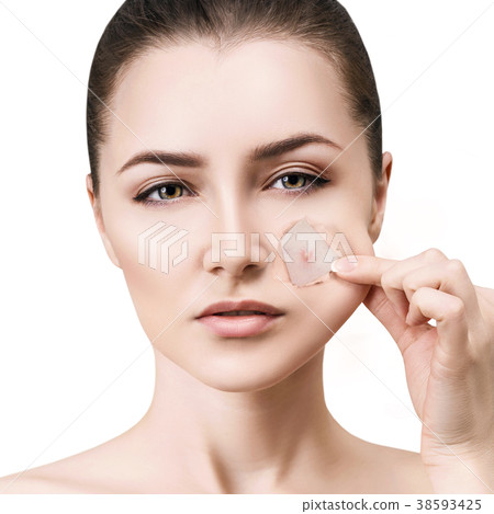 Woman with pimple on face peek from hole in 38593425