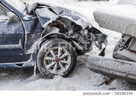 Crashed cars in accident on winter road 38598394