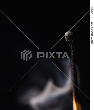 A wooden match and smoke from it A wooden match and smoke from it 38599030