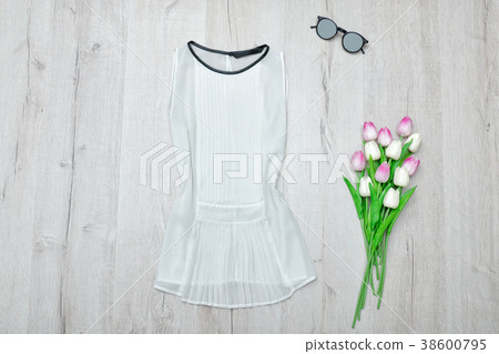 White blouse, glasses and a bouquet of tulips White blouse, glasses and a bouquet of tulips 38600795