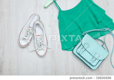 Green top, white sneakers and mint bag Green top, white sneakers and mint bag 38600886