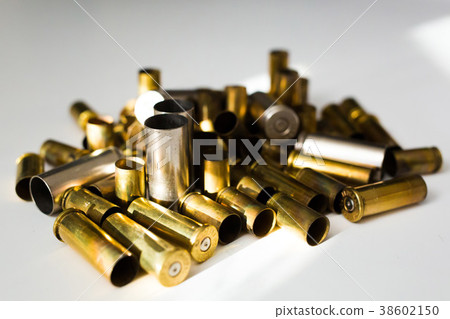 Bullet shells on a white background Bullet shells on a white background 38602150