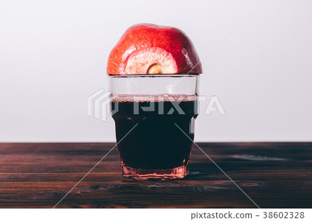 Half a pomegranate on a glass Half a pomegranate on a glass 38602328