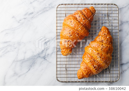 Croissants on cooling rack. Marble background Croissants on cooling rack. Marble background 38610042