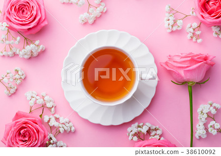 Cup of tea with fresh flowers on pink background Cup of tea with fresh flowers on pink background 38610092