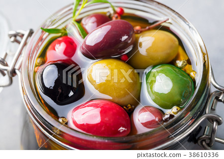 Olives assortment in glass jar with oil. Close up. Olives assortment in glass jar with oil. Close up. 38610336