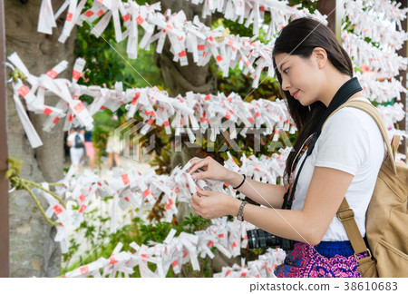 Female backpacker at Naminoue Shrine. Female backpacker at Naminoue Shrine. 38610683