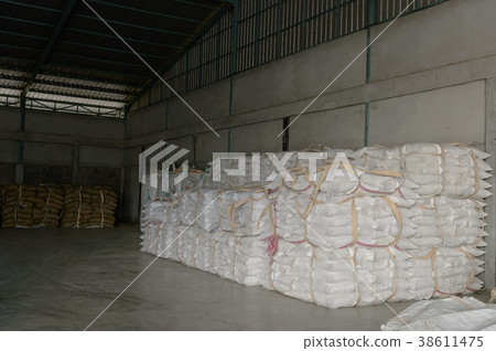 Hemp sacks containing rice in warehouse 38611475