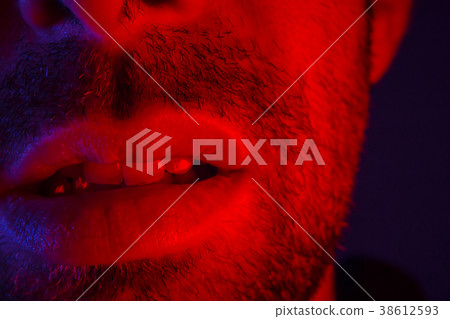 Macro close up on man with seductive expression 38612593