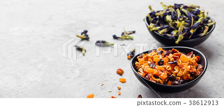 Fruit, herbal and flower tea in bowls. Copy space Fruit, herbal and flower tea in bowls. Copy space 38612913
