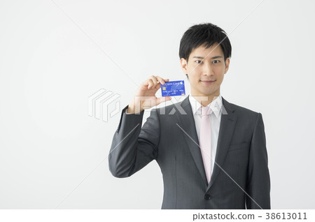 Businessman showing a credit card 38613011