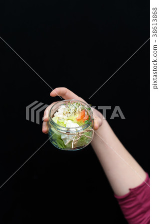 Hand holding healthy food, menu with microgreens 38613868