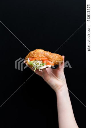 Hand holding healthy food, menu with microgreens 38613875