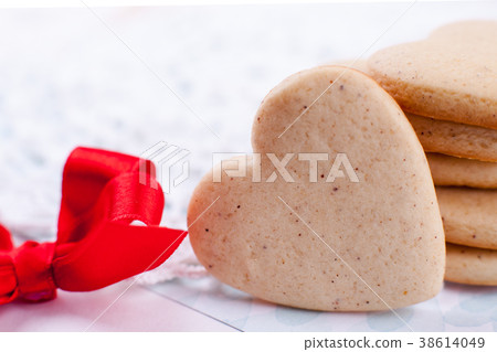 cookies in the shape of heart on a gray background cookies in the shape of heart on a gray background 38614049