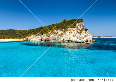 Turquoise coast of Antipaxos island near Corfu. Turquoise coast of Antipaxos island near Corfu. 38614355