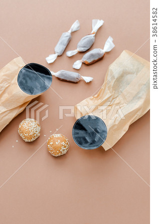 Handmade sweets in craft paper envelopes. Top view Handmade sweets in craft paper envelopes. Top view 38614582