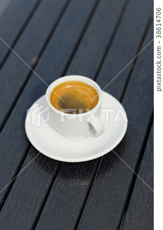 White coffee cup on black wood table background 38614706