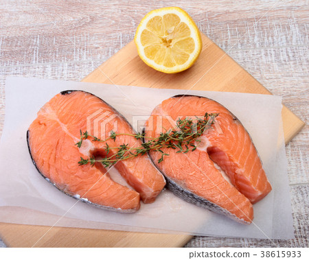 fresh raw salmon with spices and lemon 38615933