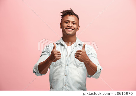 The happy business man standing and smiling The happy business man standing and smiling 38615970