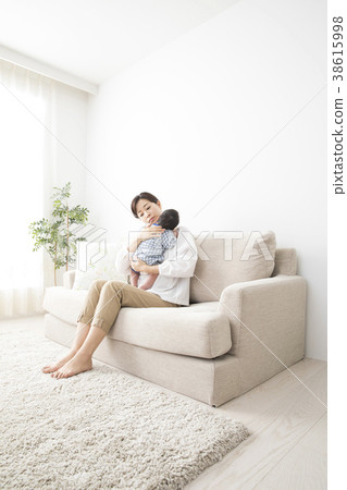 Woman holding a baby Woman holding a baby 38615998
