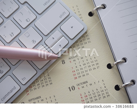 Business image · calendar · keyboard · notebook · woman 38616688