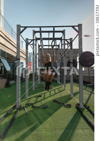 Fitness woman workout on crossfit rings. Fitness woman workout on crossfit rings. 38617392
