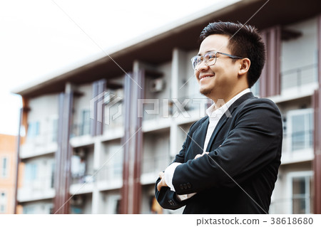 Portrait of a smiling handsome businessman with 38618680