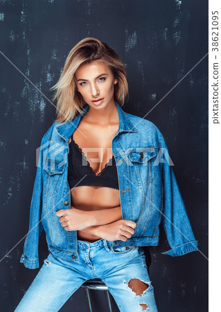 Portrait of pretty blonde woman sits on a chair 38621095