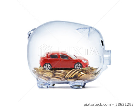 Red car on money inside transparent piggy bank Red car on money inside transparent piggy bank 38621292