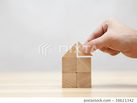 Hand building house with wooden blocks Hand building house with wooden blocks 38621342