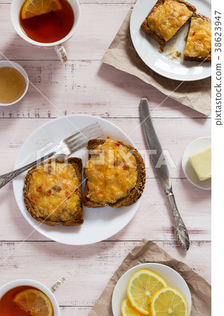 Toasts with cheese and lemon tea 38623947