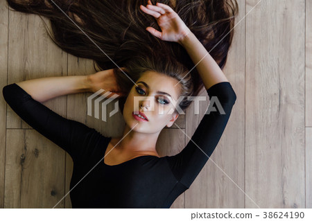 Beautiful young model ballet dancer lying inon Beautiful young model ballet dancer lying inon 38624190