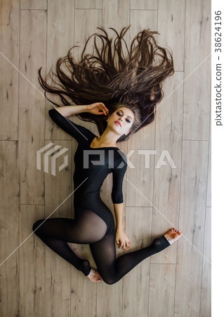Beautiful young model ballet dancer lying inon 38624196